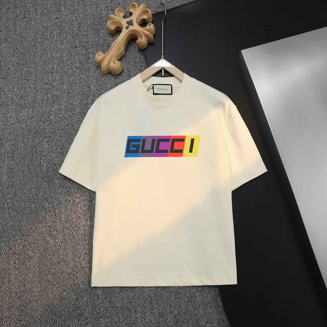 Cream Gucci T-shirt with colorful logo on chest, crew neck short sleeves.