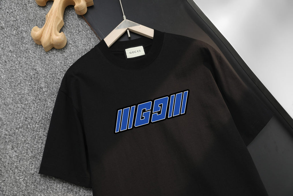 Black Gucci T-shirt front view with blue logo print across chest