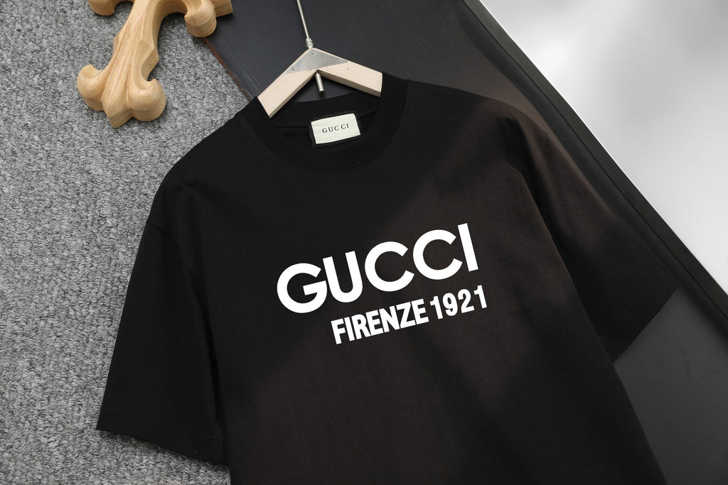 Front of black short-sleeve T-shirt with GUCCI and FIRENZE 1921 text