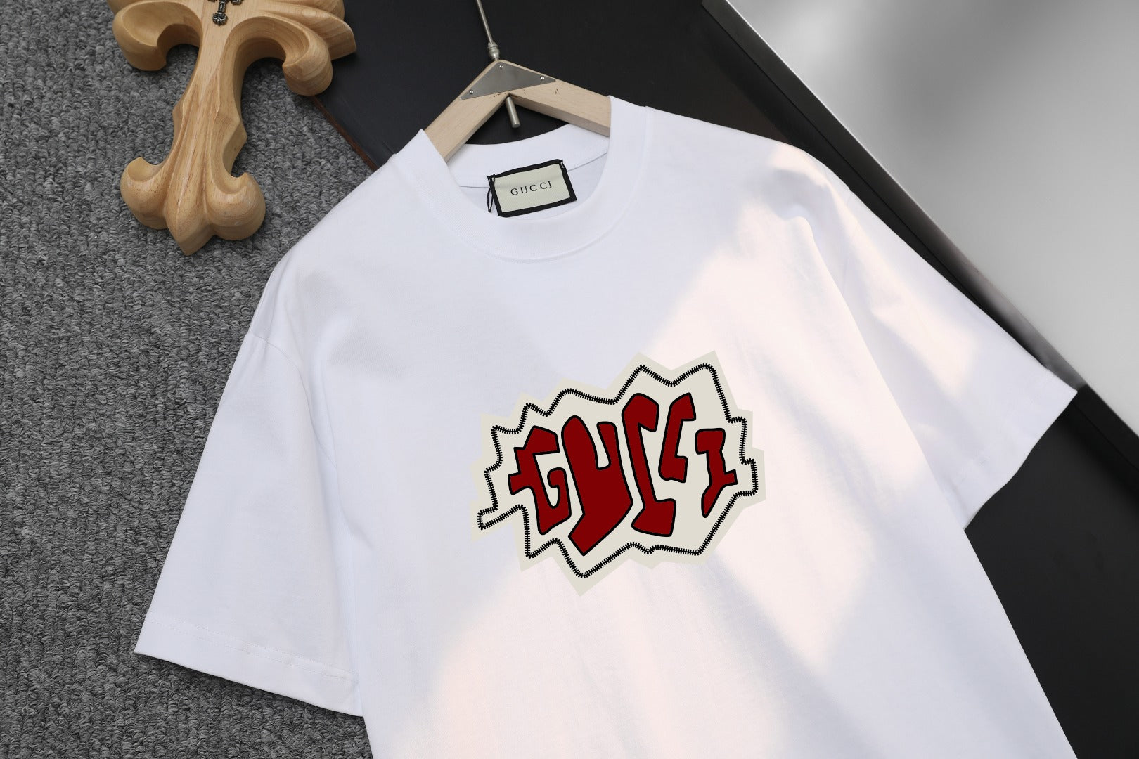 White Gucci T-shirt with red-and-black chest graphic logo