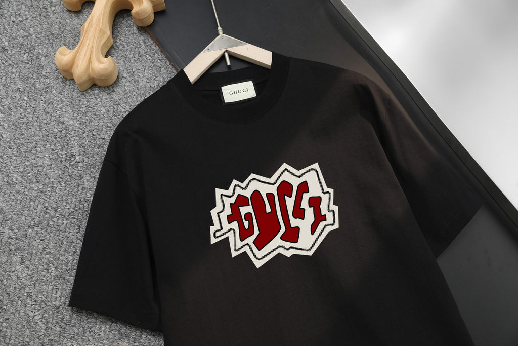 Black Gucci graphic short-sleeve T-shirt on hanger, crew neck