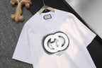 White Gucci short-sleeve T-shirt with large GG logo print, chest close-up