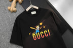 Black Gucci T-shirt with 'GUCCI' logo and cartoon graphic