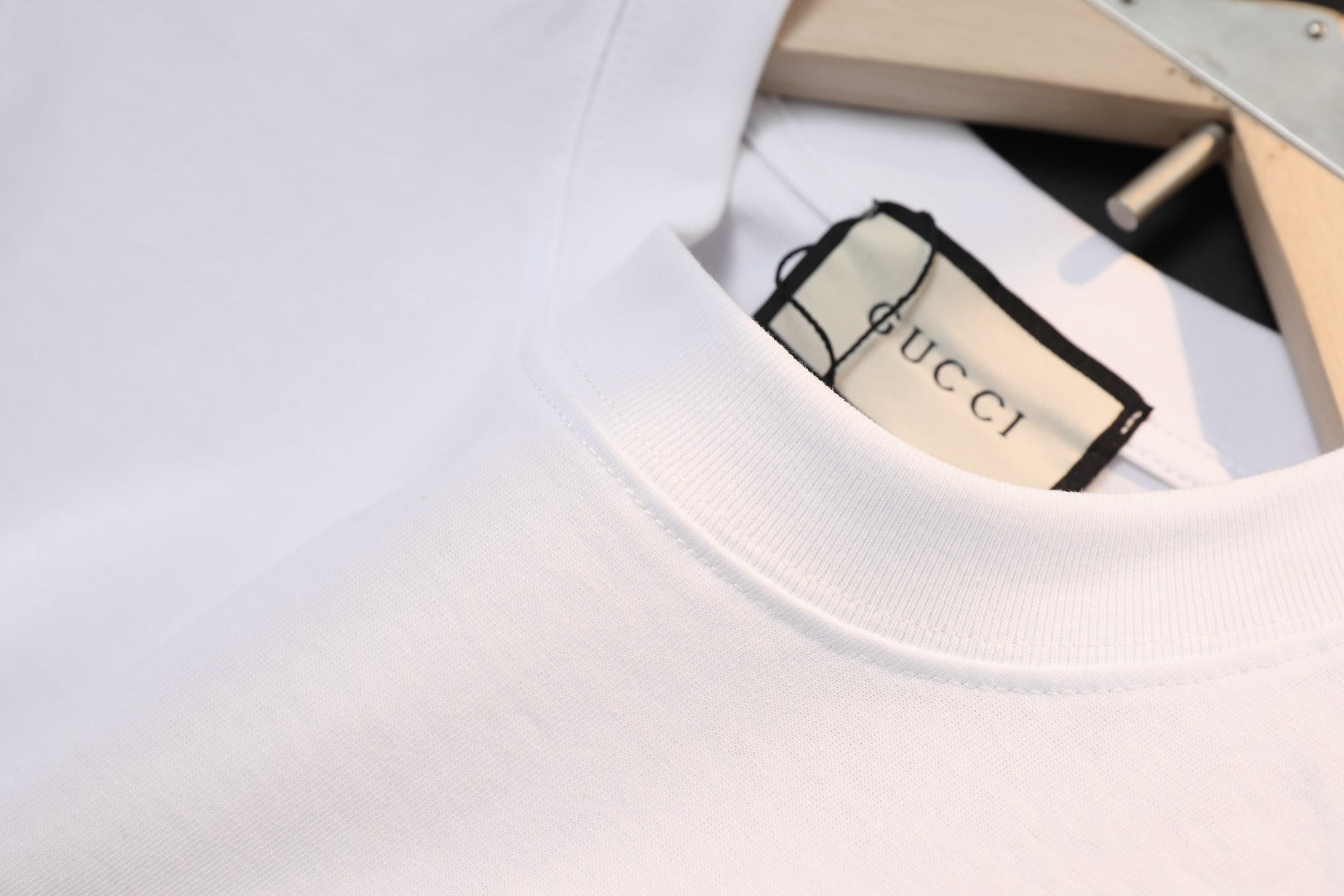 White Gucci T-shirt with crew neck and brand tag inside collar