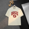 Cream Gucci T-shirt with red and green logo graphic on front