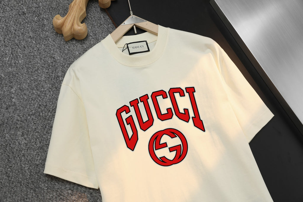 Cream Gucci T-shirt close-up of bold red logo graphic