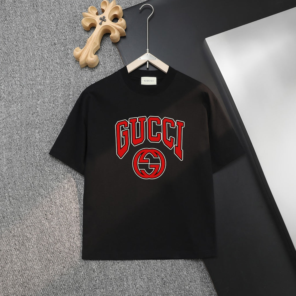 Black T-shirt with GUCCI logo graphic in red and green on the chest