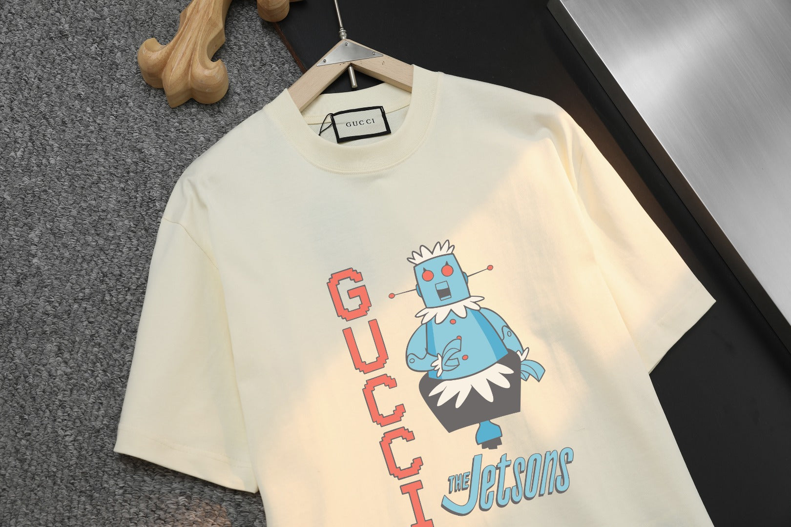 Light cream Gucci graphic T-shirt, centered cartoon and stacked GUCCI text