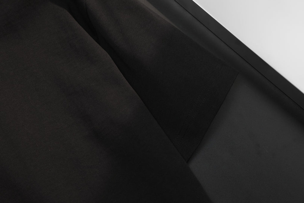 Black T-shirt sleeve and hem detail