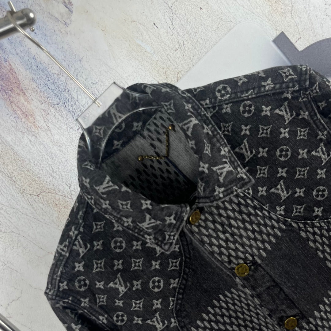 Louis Vuitton denim jacket close-up of shoulder and collar with gold buttons