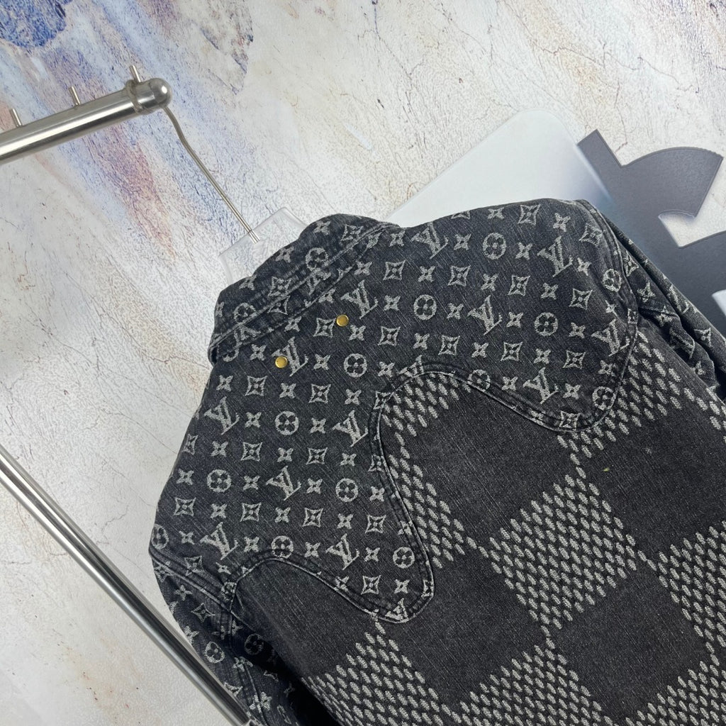 Louis Vuitton denim jacket side close-up with monogram print and patchwork panel
