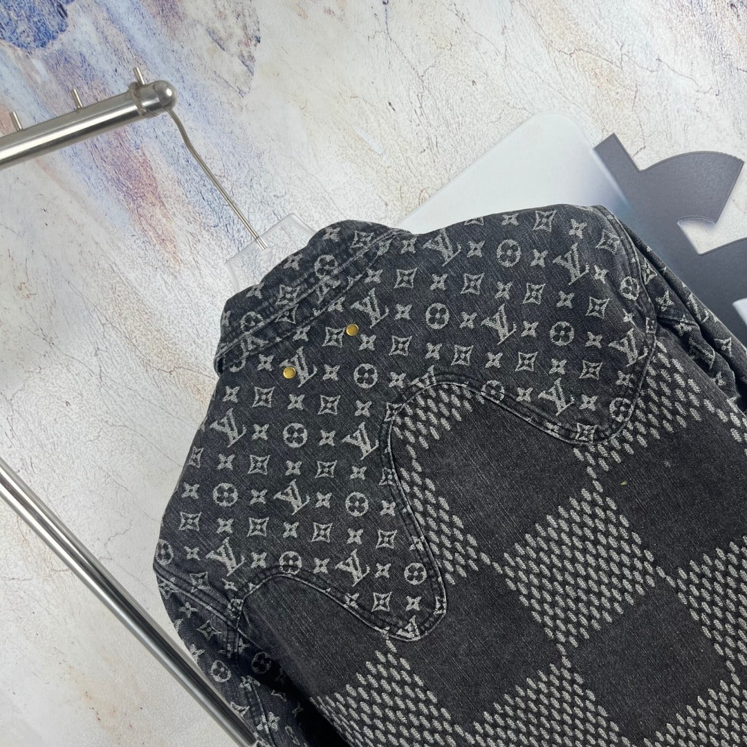 Louis Vuitton denim jacket side close-up with monogram print and patchwork panel
