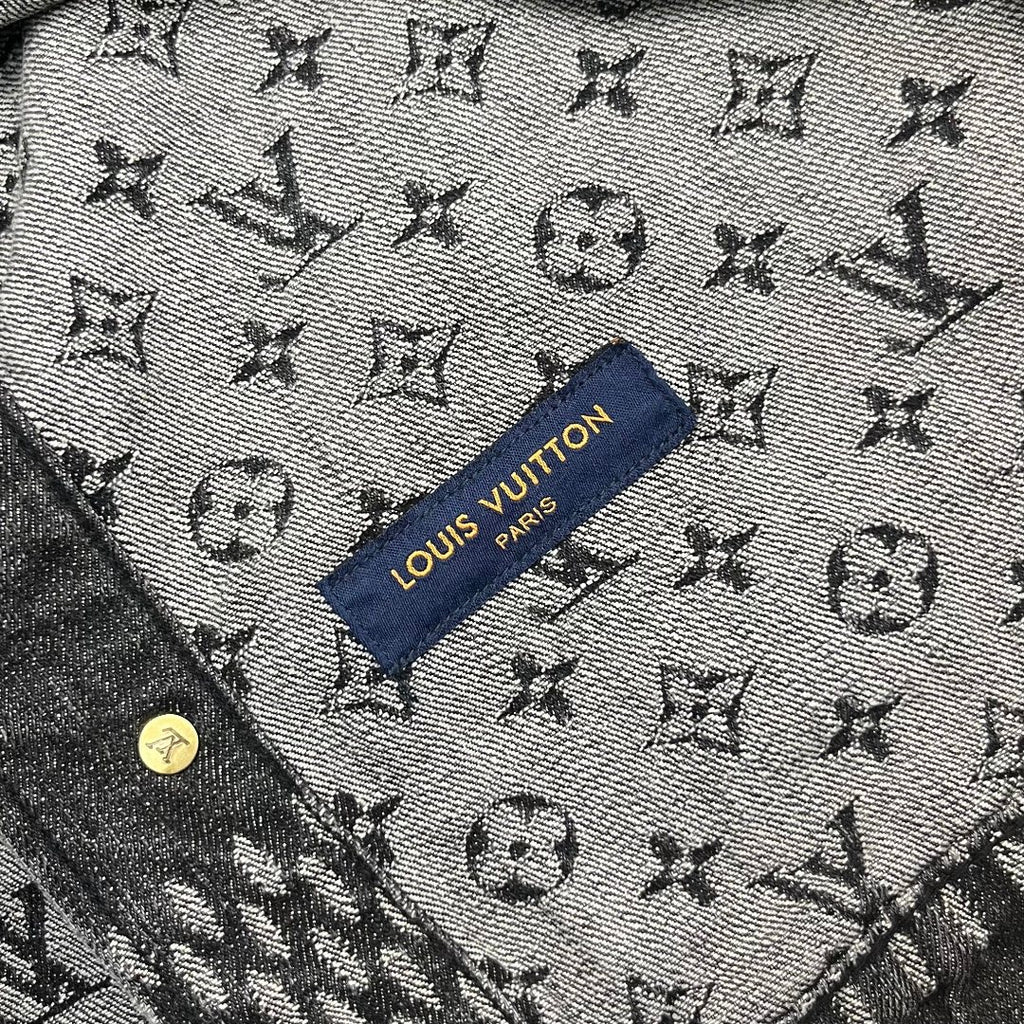 Louis Vuitton denim fabric close-up with all-over monogram and blue brand label