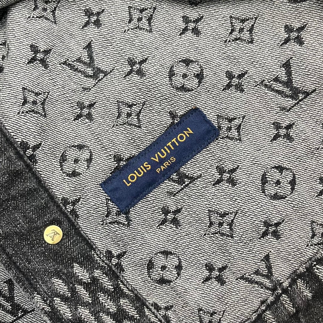 Louis Vuitton denim fabric close-up with all-over monogram and blue brand label