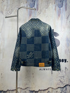 Monogram denim jacket, back view, with blue patchwork panels and gold buttons