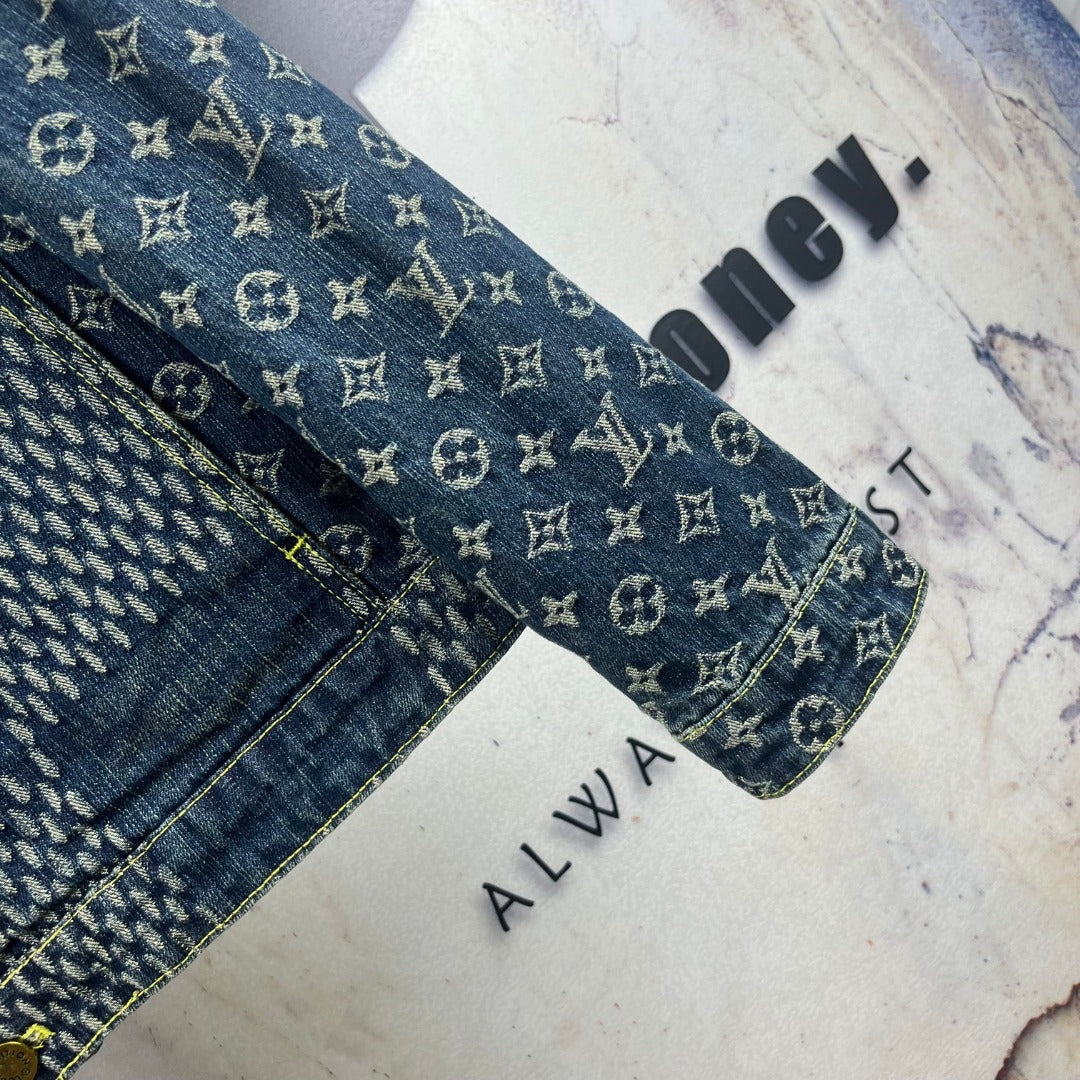 Monogram denim jacket sleeve cuff detail with gold stitching and hem label