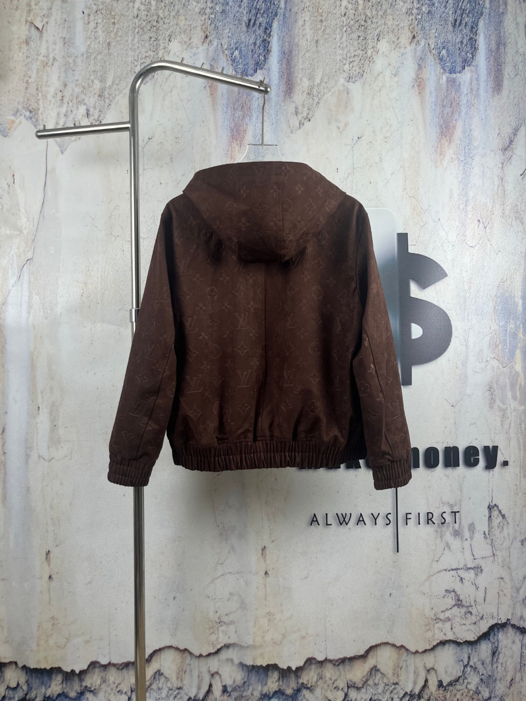 Brown monogram zip-up hooded jacket, back view with ribbed cuffs and hem