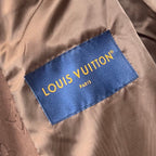 Louis Vuitton brand label on brown monogram hooded jacket
