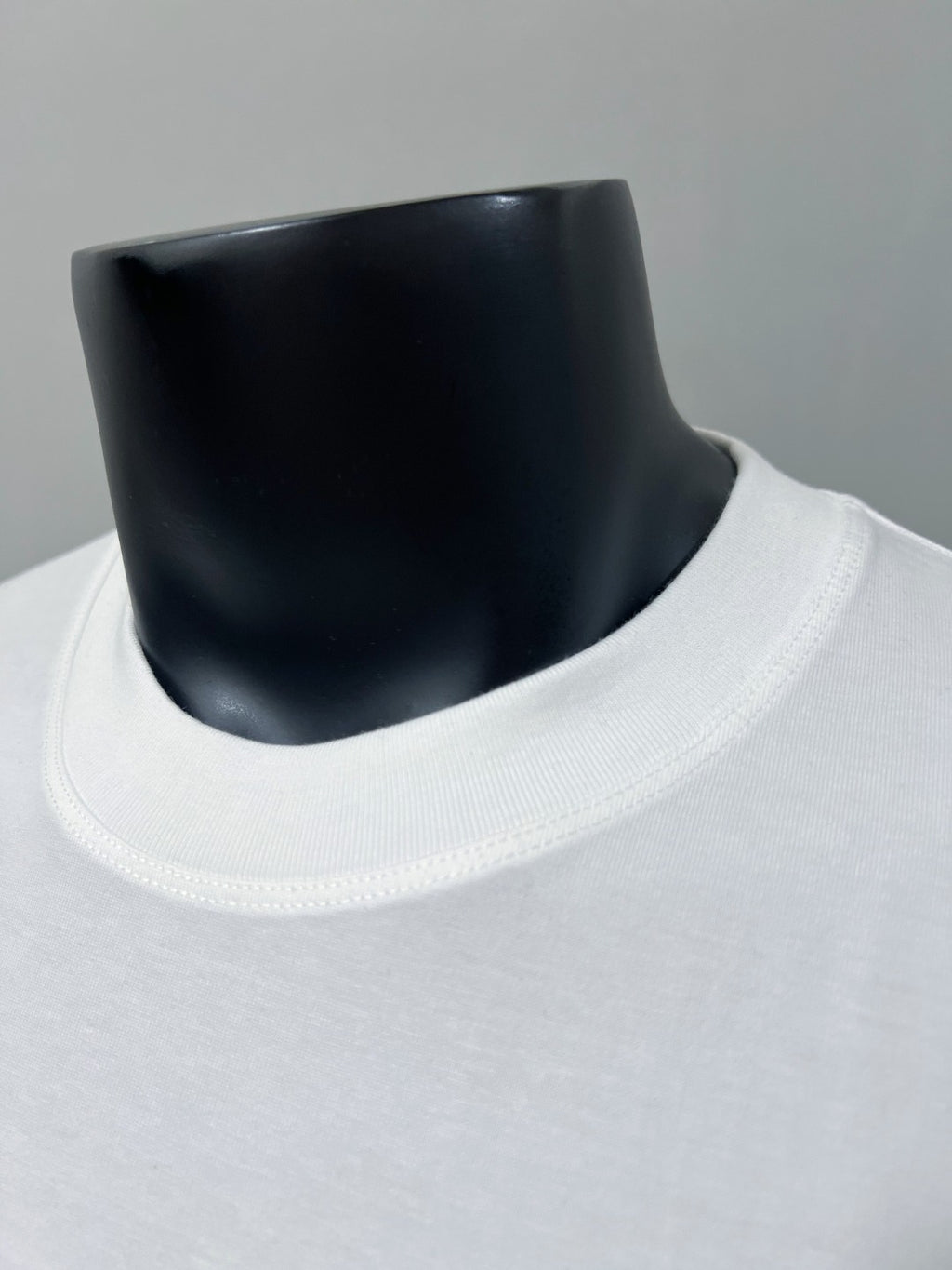 Gucci white crewneck T-shirt neckline close-up with ribbed collar