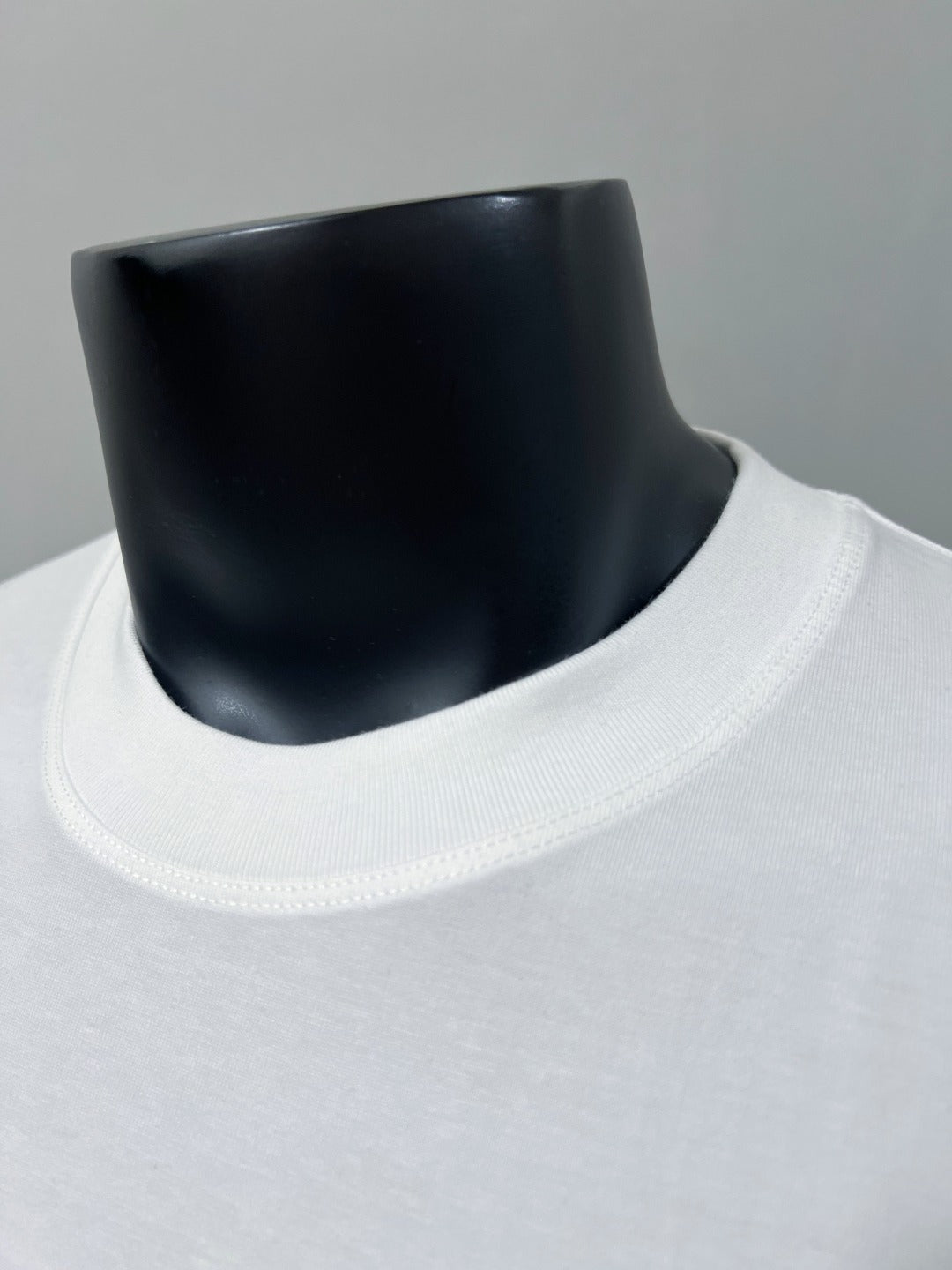 Gucci white crewneck T-shirt neckline close-up with ribbed collar