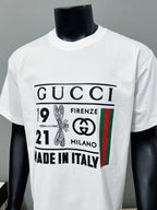 Gucci white crewneck T-shirt front view with bold logo print and Made in Italy