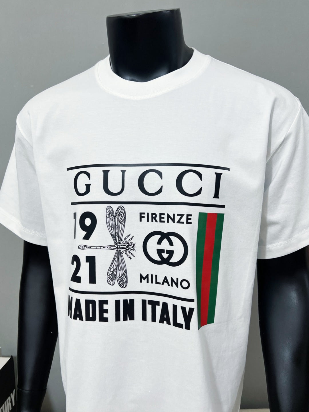 Gucci white crewneck T-shirt front view with bold logo print and Made in Italy