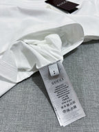 Gucci white T-shirt fabric label and care tag on inside seam