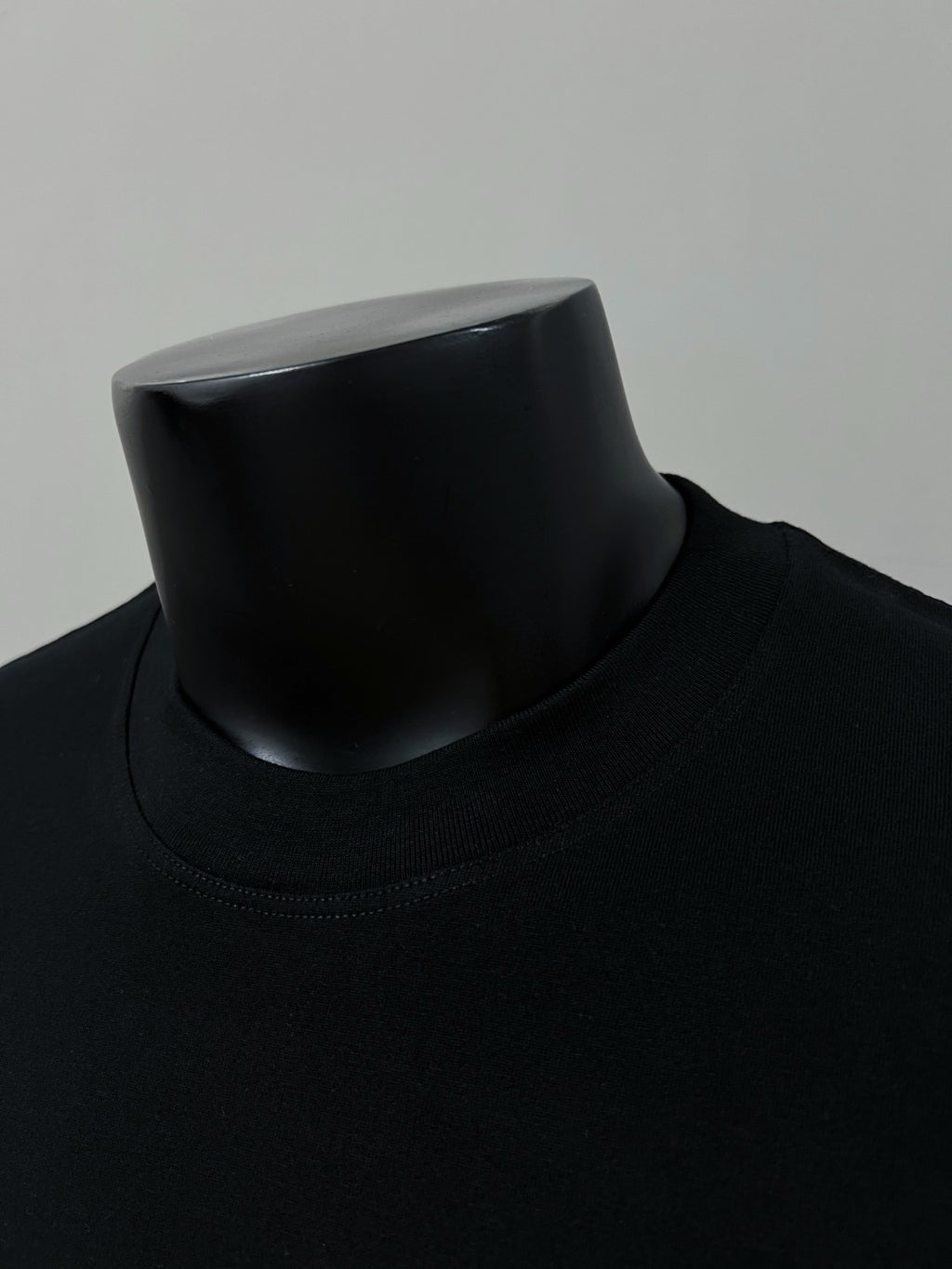 Black crewneck T-shirt collar close-up