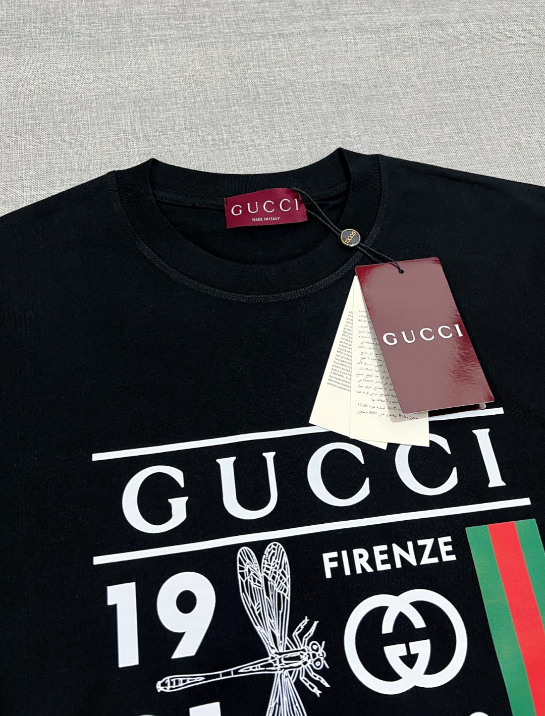 Black Gucci graphic T-shirt neckline with tag attached
