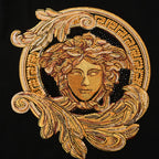 Gold Medusa crest graphic with ornate circular border on a black Versace T-shirt