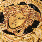 Gold Medusa crest sequin-style graphic detail on a black Versace T-shirt
