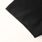 Black Versace T-shirt sleeve cuff detail with stitched seam