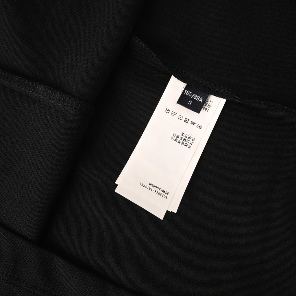 Black Versace T-shirt with white size-care label at the inner back