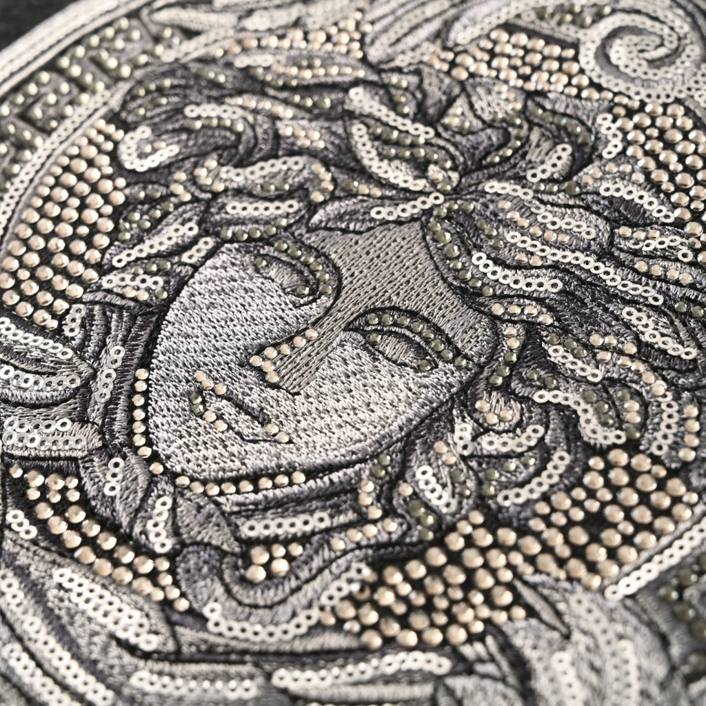 Versace T-shirt close-up of the sequined Medusa face graphic in silver tone