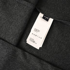 Versace T-shirt inside size label on dark gray fabric