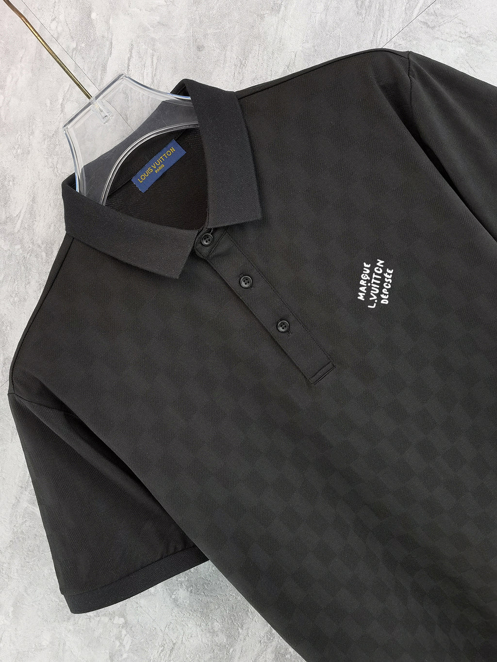 Louis Vuitton black polo shirt collar and front, button placket, chest logo detail