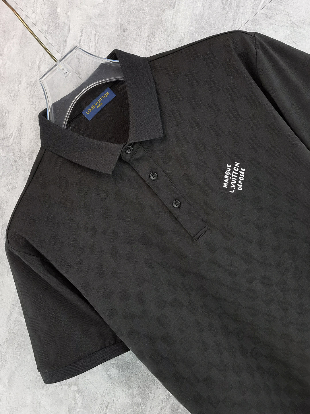 Louis Vuitton black polo shirt collar and front, button placket, chest logo detail