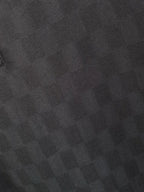 Black polo shirt fabric texture close-up