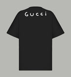 Black Gucci T-shirt back view with “GUCCI” lettering across the upper back.