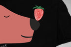 Black Gucci T-shirt close-up of face graphic with red strawberry icon and details.