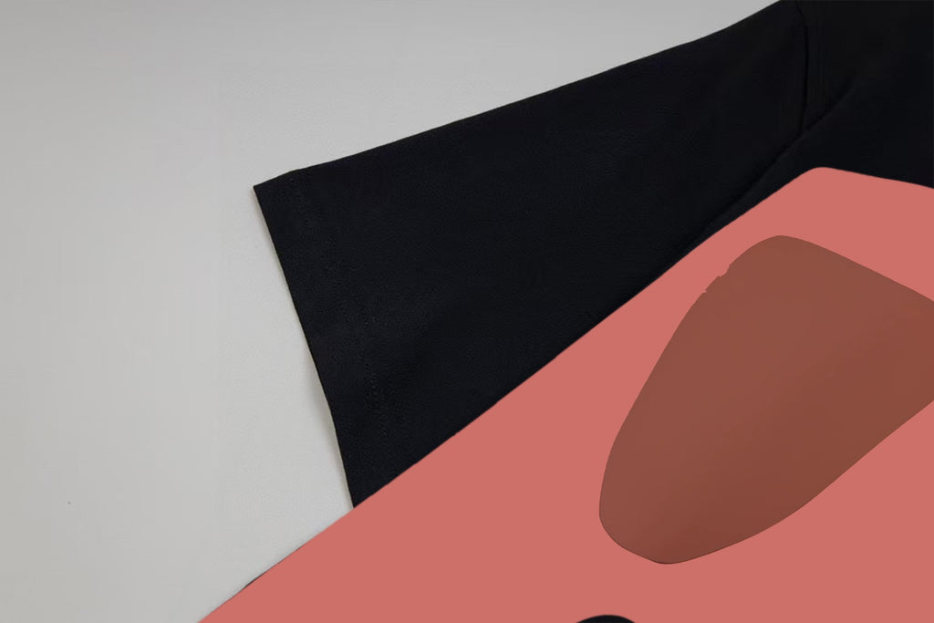 Black Gucci T-shirt sleeve and face graphic print with pink shape.