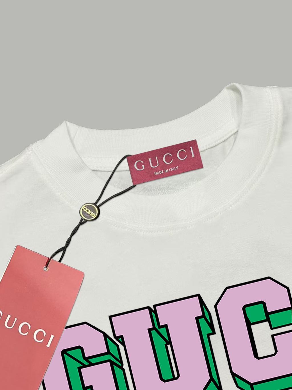 White T-shirt with Gucci neck label and colorful GUCCI graphic