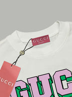White T-shirt with Gucci neck label and colorful GUCCI graphic