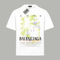 White short-sleeve T-shirt with neon green and purple abstract print and BALENCIAGA text