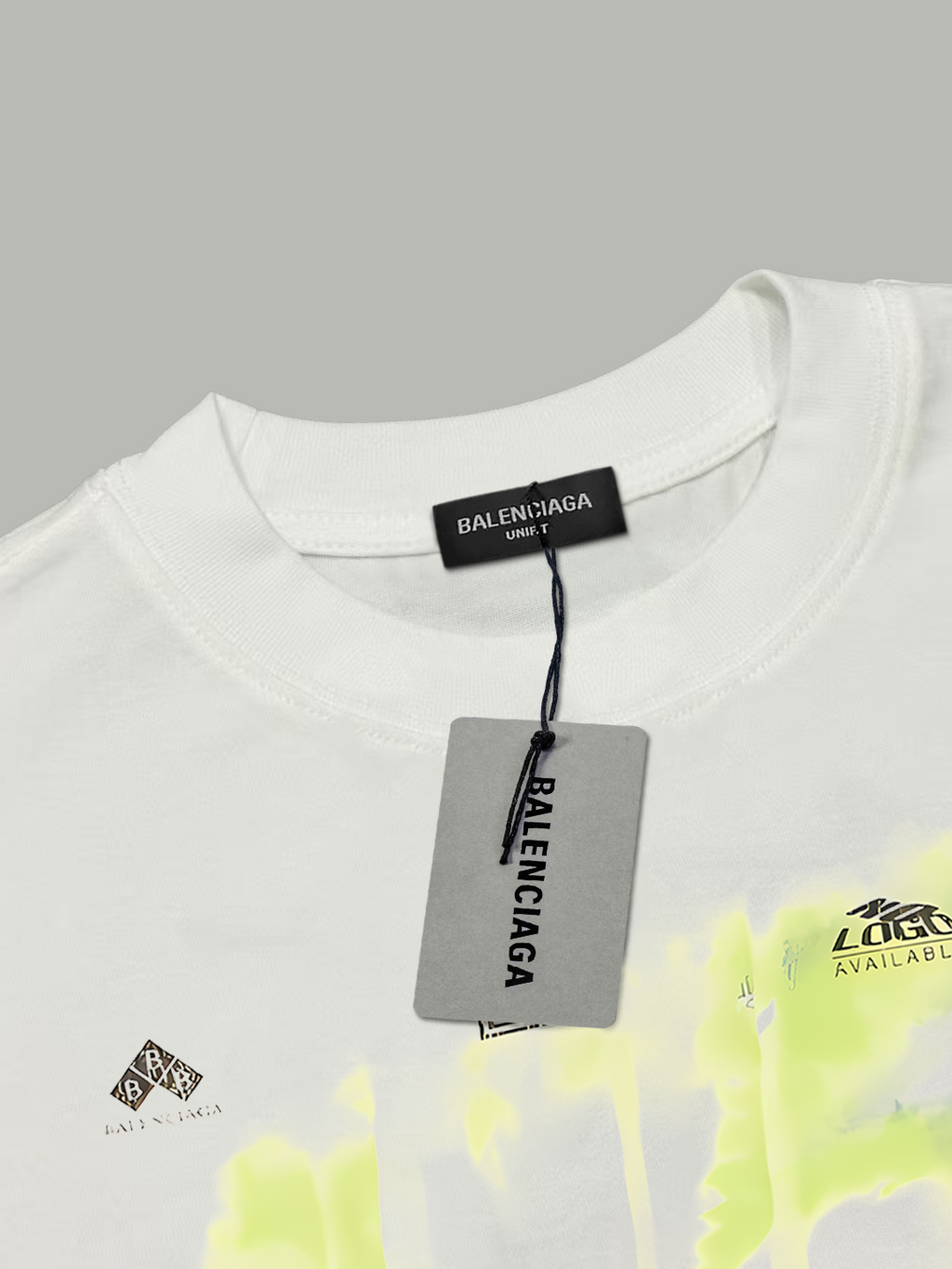 White short-sleeve T-shirt neckline with BALENCIAGA tag and partial neon graphic print