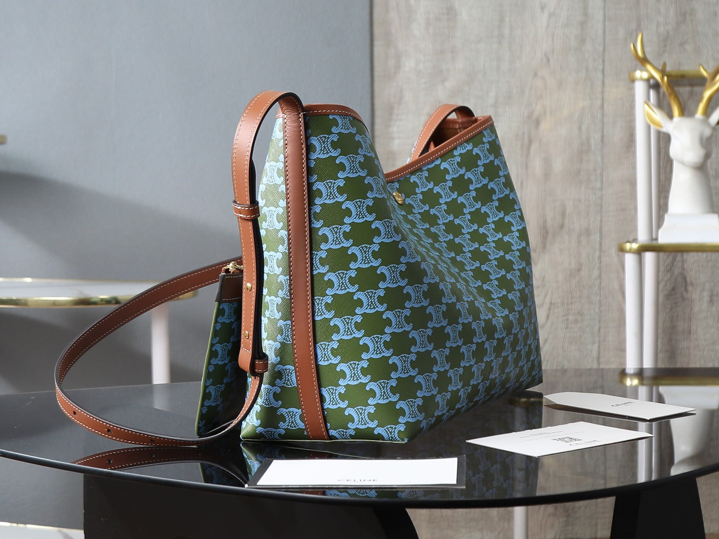 Celine patterned shoulder bag with brown handles and crossbody strap