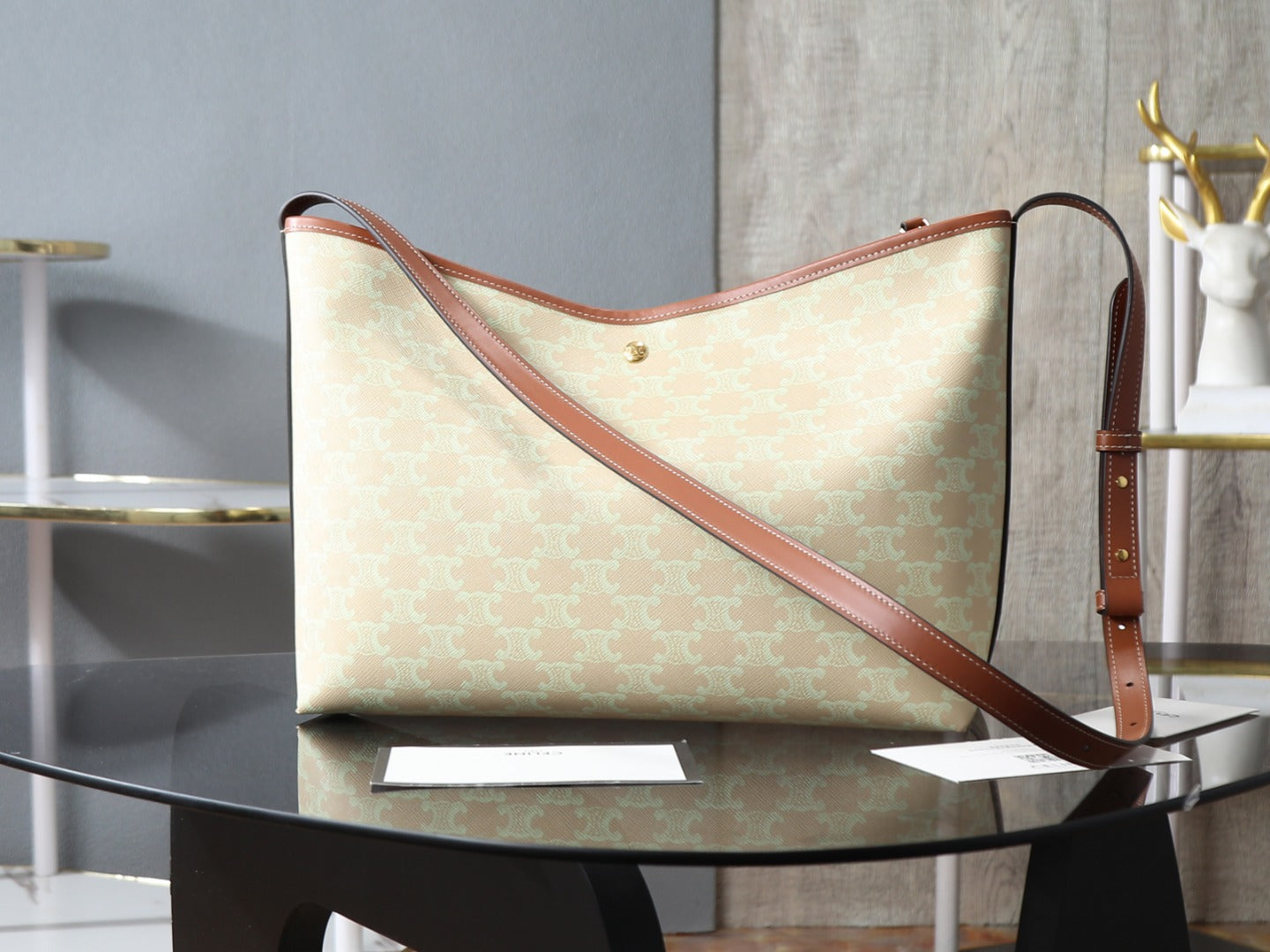 Celine tote bag with light beige pattern and brown crossbody shoulder strap