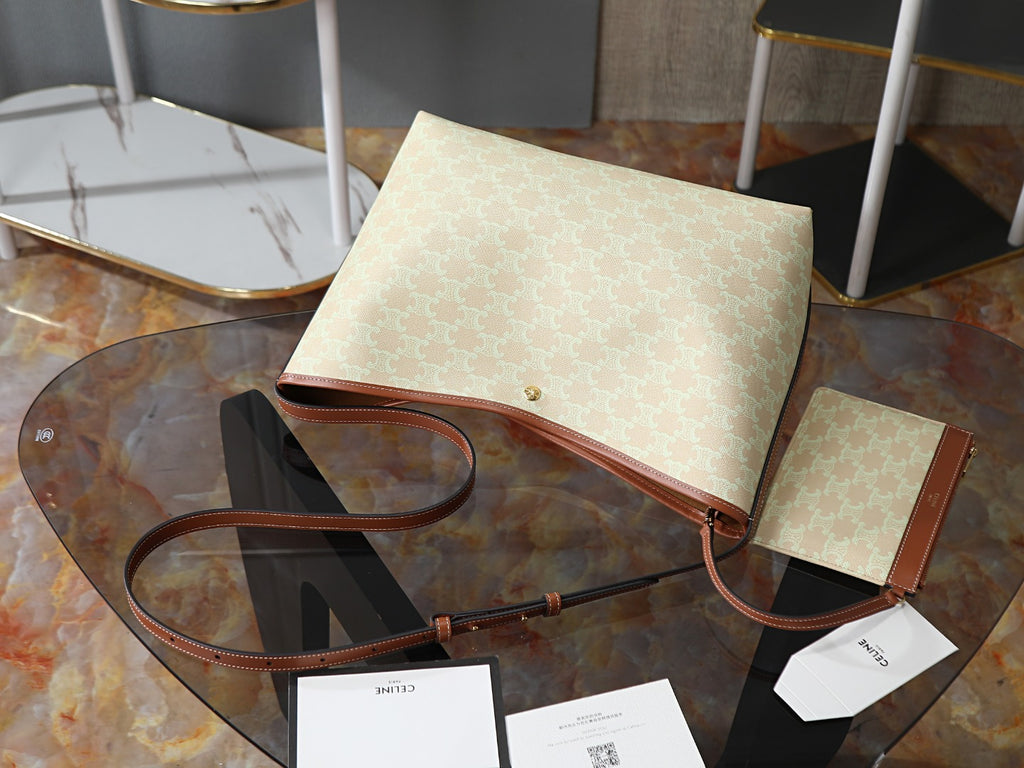 Celine tote bag laid flat with brown leather straps and matching small pouch