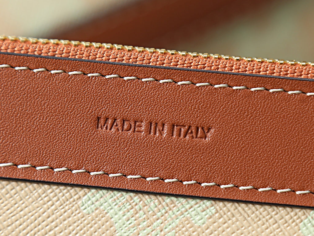 Brown leather trim with stitched edge and “MADE IN ITALY” embossing