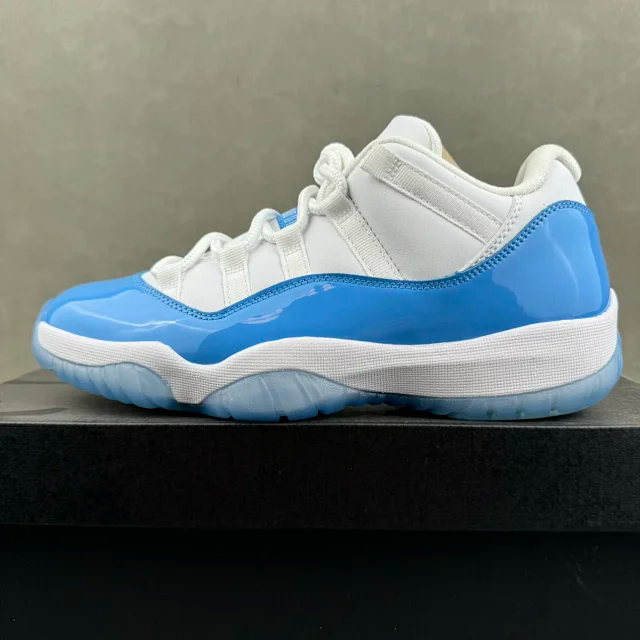 White and blue low-top sneakers with white laces and blue side panels